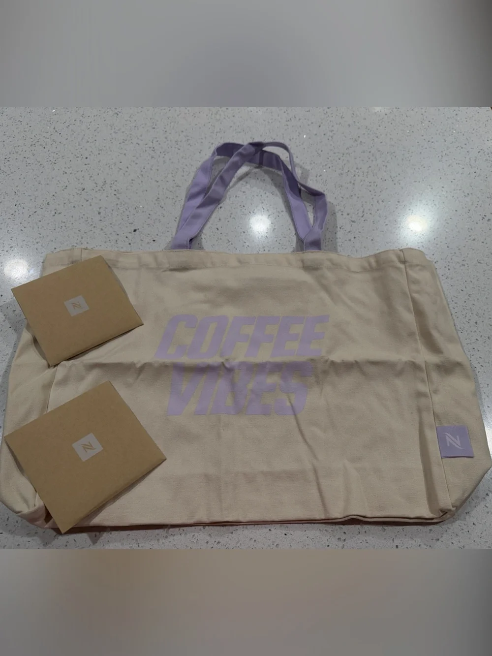 Nespresso Cream Canvas Tote with Lavender Print and Straps & Pair of coasters